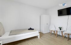 Schlafzimmer 2 mit zwei Einzelbetten, Sitzecke und Smart TV Schlafzimmer 2 mit zwei Einzelbetten, Sitzecke und Smart TV
