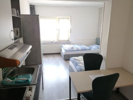 Geräumiges 1-Zimmer-Microapartment mit 3 Einzelbetten Bild 1 Geräumiges 1-Zimmer-Microapartment mit 3 Einzelbetten Bild 1