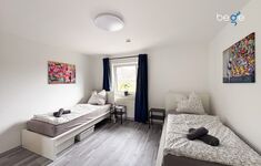 Schlafzimmer 3 mit zwei Einzelbetten, Sitzecke und Smart TV Schlafzimmer 3 mit zwei Einzelbetten, Sitzecke und Smart TV