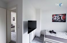 Schlafzimmer 3 mit zwei Einzelbetten, Sitzecke und Smart TV Schlafzimmer 3 mit zwei Einzelbetten, Sitzecke und Smart TV