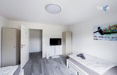 Schlafzimmer 2 mit zwei Einzelbetten, Sitzecke und Smart TV Schlafzimmer 2 mit zwei Einzelbetten, Sitzecke und Smart TV