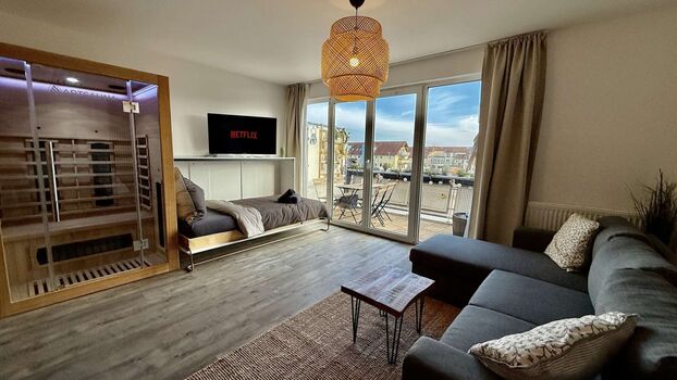 🛋️ Wohnbereich mit Schlafcouch und Sauna 🛋️ Wohnbereich mit Schlafcouch und Sauna