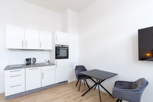 Beispiel einer eigenen Küche mit Essplatz im Apartment Beispiel einer eigenen Küche mit Essplatz im Apartment