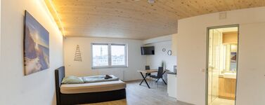 Monteurzimmer Lübeck – helles Apartment mit Bett, Essplatz und TV Monteurzimmer Lübeck – helles Apartment mit Bett, Essplatz und TV