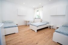 Schlafzimmer mit drei Einzelbetten Schlafzimmer mit drei Einzelbetten