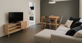 Wohnzimmer mit TV und Schlafcouch Wohnzimmer mit TV und Schlafcouch
