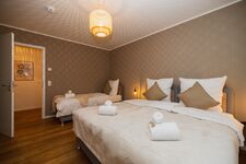 Schlafzimmer mit drei Einzelbetten Schlafzimmer mit drei Einzelbetten