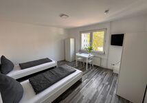 Top ausgestattetes Apartment mit Doppelzimmern&Einzelbetten Bild 4