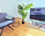 Cosy reading corner with armchair. Relax in your holiday apartment near Trier. 