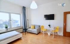 Sitzecke mit Smart Tv in Schlafzimmer 1 