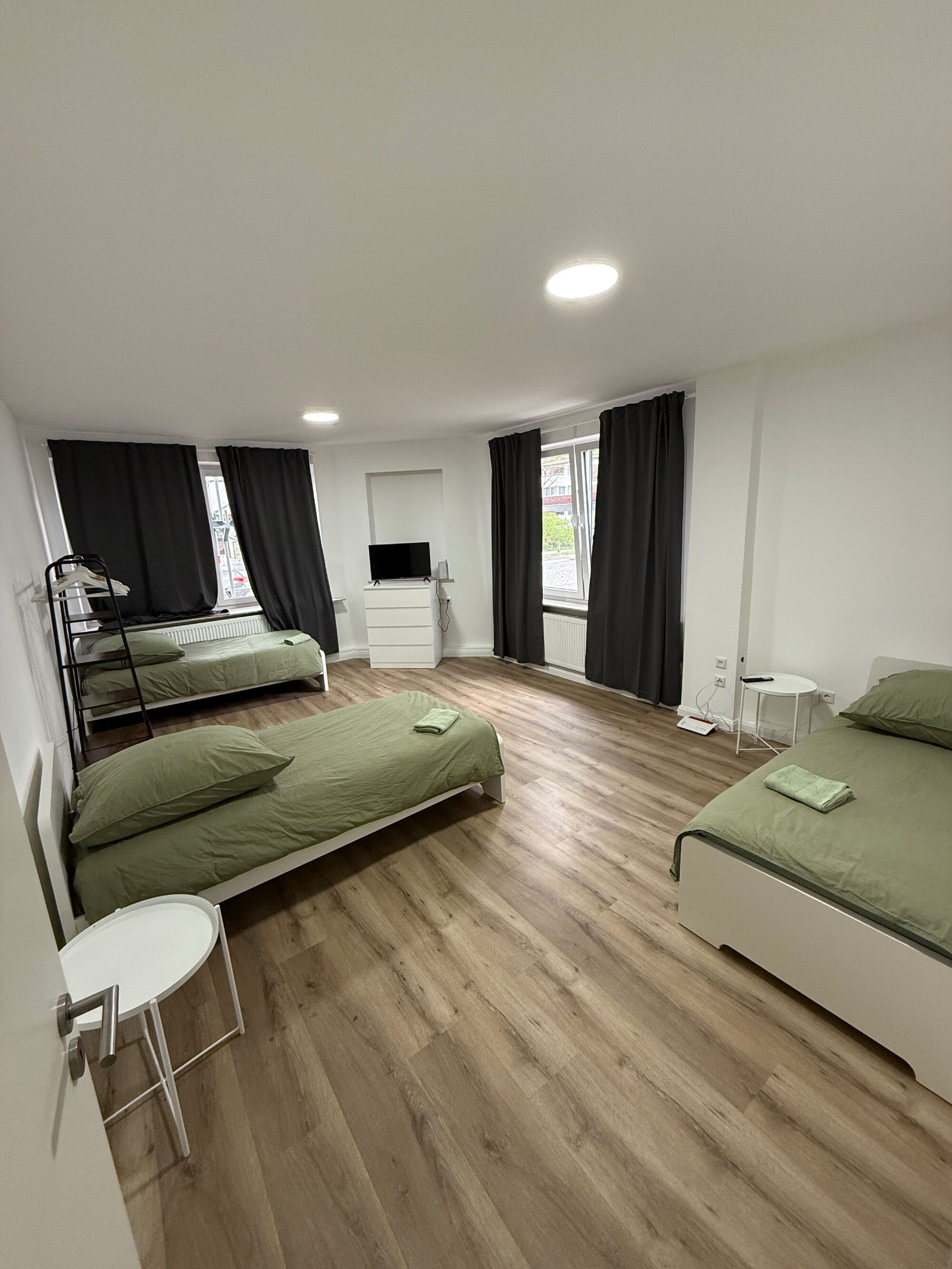 Wohnzimmer mit 3 Einzelbetten