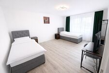 Apartments | WLAN, Smart TV, Küche, WM, Trockner, Parkplätze (LKW) Bild 8