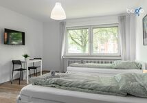 Schlafzimmer 2 mit Sitzecke und Smart TV