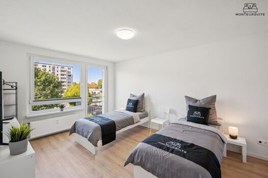 Schlafzimmer mit zwei Einzelbetten