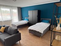 ProStays Appartement mit 4 Einzelbetten Bild 1