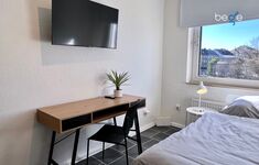 Schlafzimmer 3 mit einem Einzelbett, Sitzecke und Smart TV