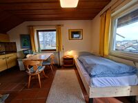 Wohnraum mit Einzelbett 