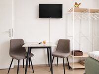 Schlafzimmer3 - Sitzbereich inklusive Smart-TV