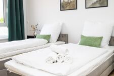 Schlafzimmer 1 mit 2 Einzelbetten oder einem Doppelbett