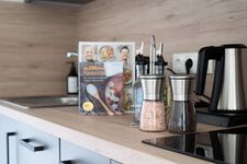 Modern eingerichtete Studios mit voll ausgestatteter Küche Bild 18