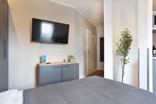 Modern eingerichtete Studios mit voll ausgestatteter Küche Bild 10