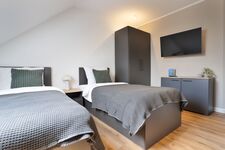 Modern eingerichtete Studios mit voll ausgestatteter Küche Bild 2