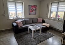 Wohnzimmer mit Schlafsofa inkl. Topper