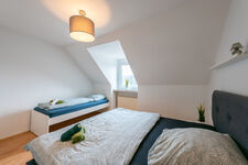 Wohnung 1: Doppelbett + Einzelbett (Schlafzimmer 2)